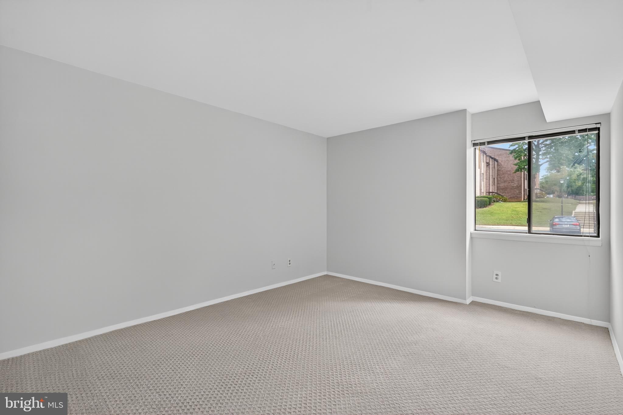 18910 Smoothstone Way, Unit 4 Montgomery Village, MD 20886 - Photo 13 of 30 a view of an empty room with a window