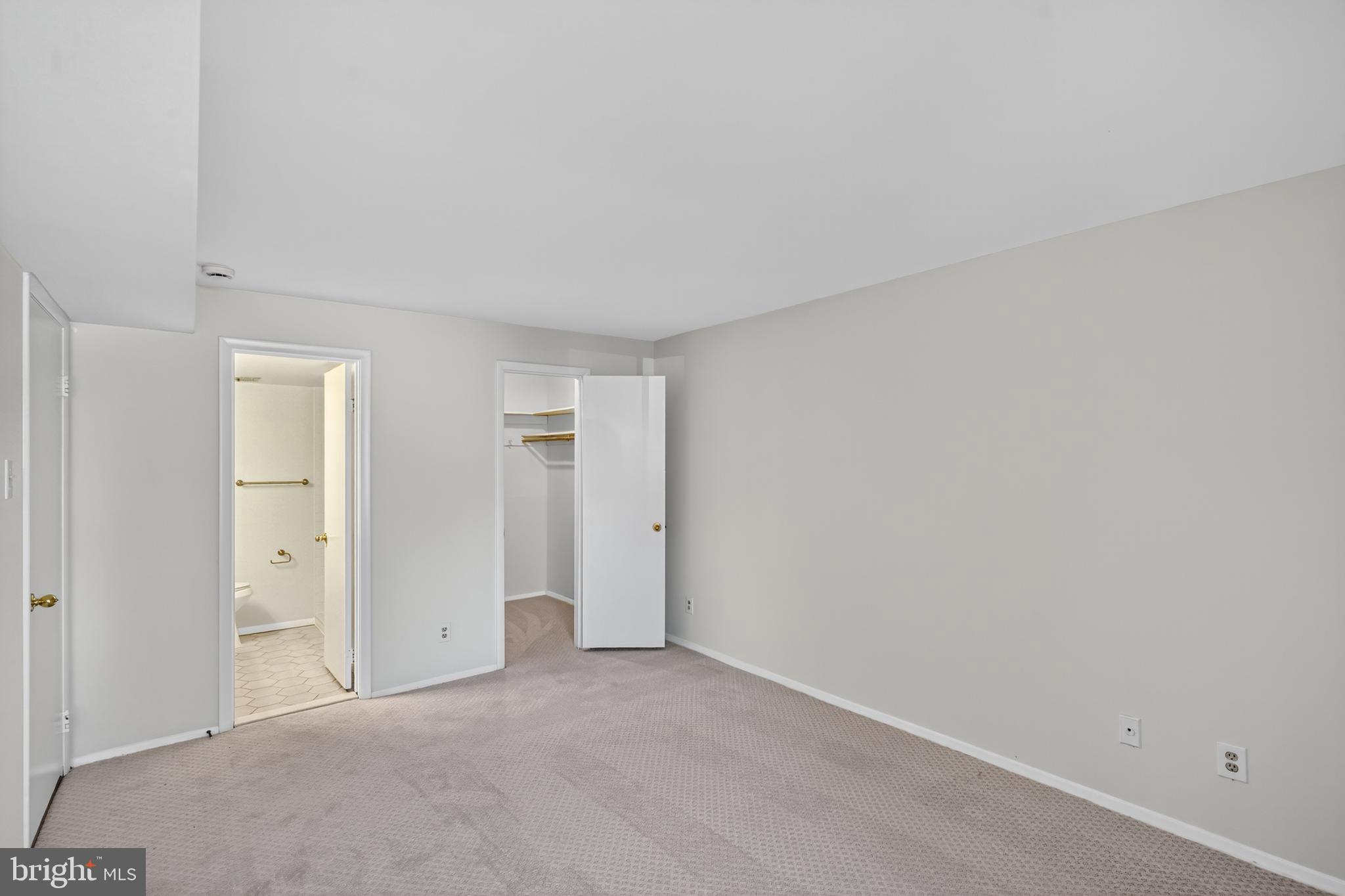 18910 Smoothstone Way, Unit 4 Montgomery Village, MD 20886 - Photo 14 of 30 a view of an empty room and closet area