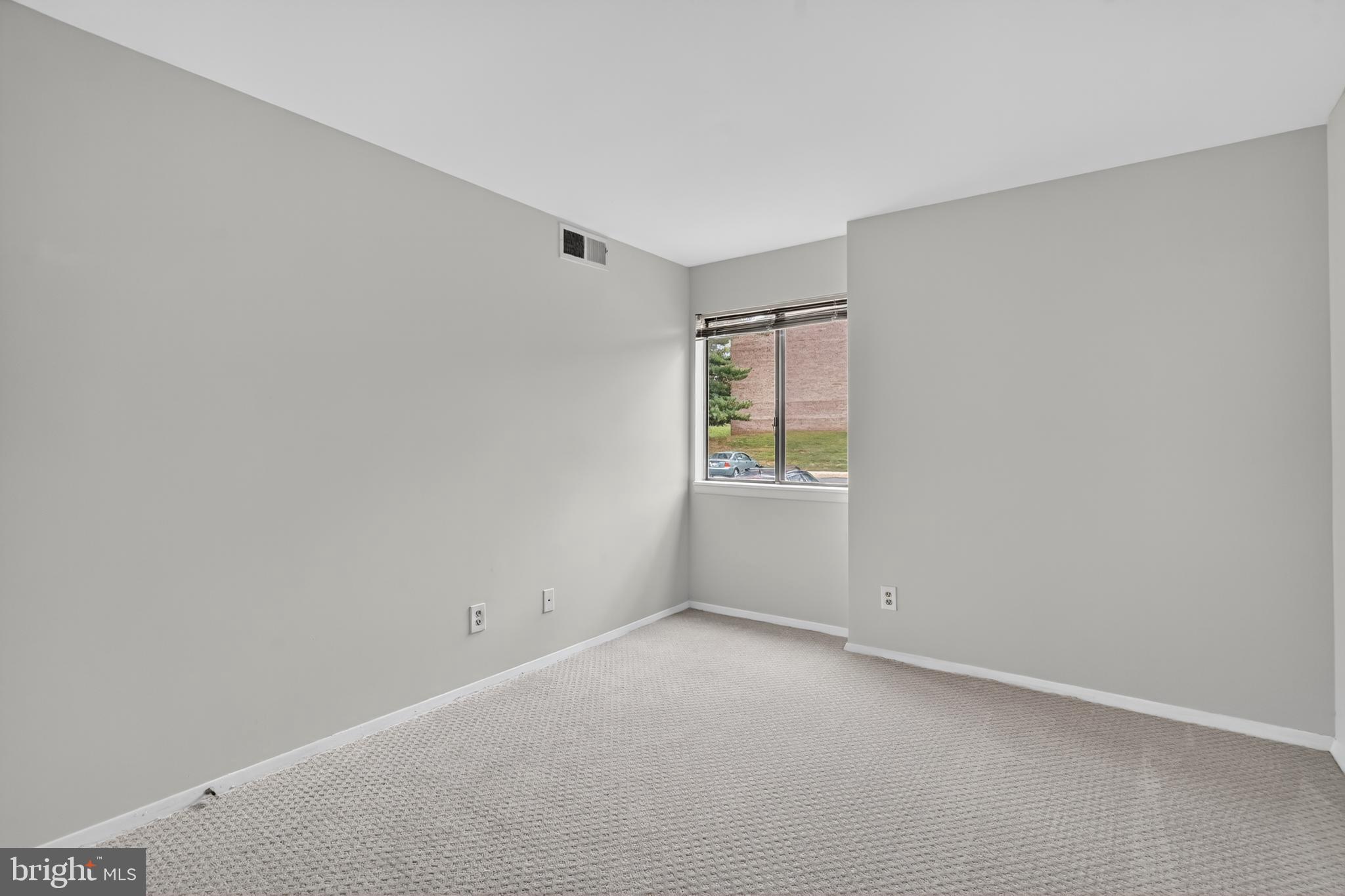 18910 Smoothstone Way, Unit 4 Montgomery Village, MD 20886 - Photo 20 of 30 a view of an empty room with a window