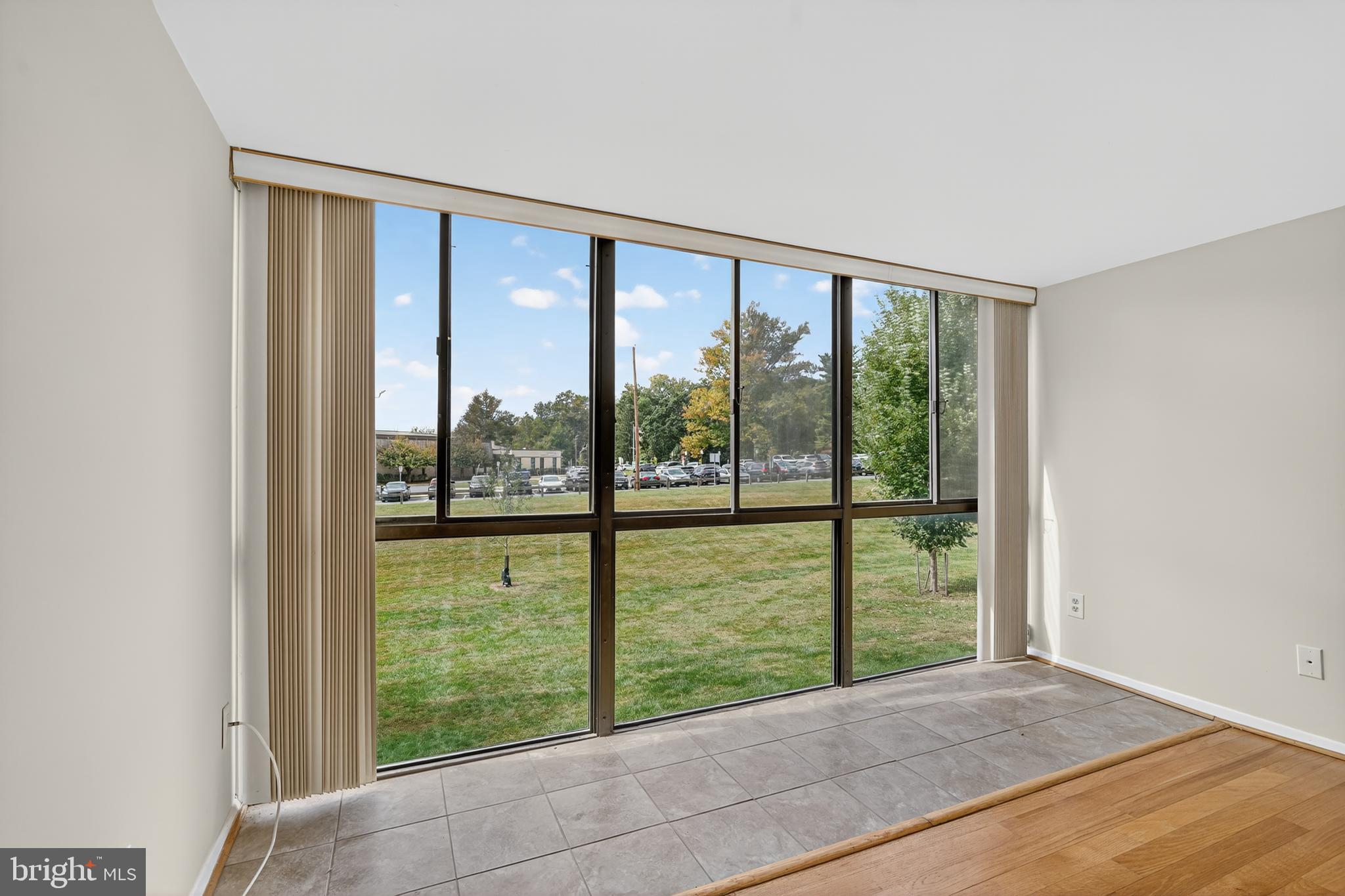 18910 Smoothstone Way, Unit 4 Montgomery Village, MD 20886 - Photo 21 of 30 a view of an empty room with large windows