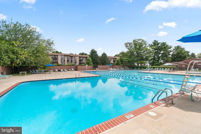 a view of a swimming pool with a patio