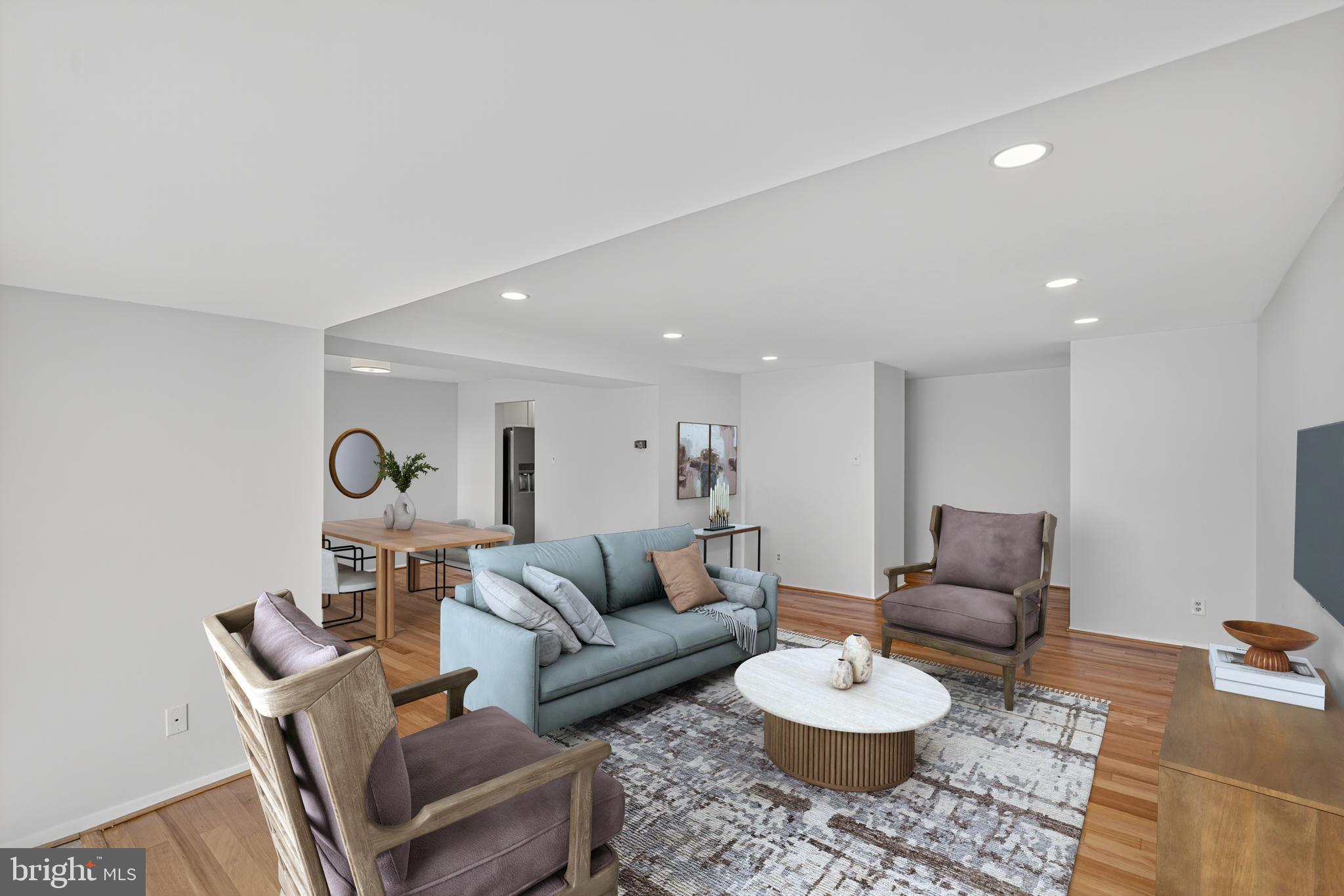 18910 Smoothstone Way, Unit 4 Montgomery Village, MD 20886 - Photo 4 of 30 a living room with furniture and a rug