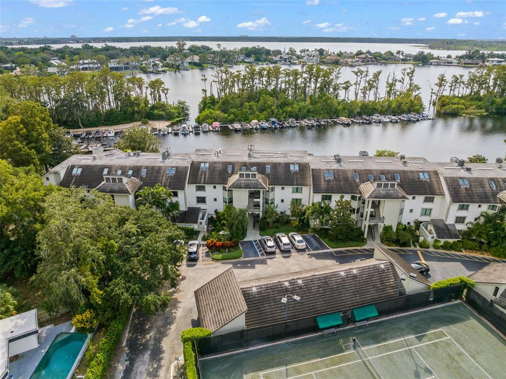 6312 Masters Boulevard, Unit O2 Orlando, FL 32819 - Photo 1 of 1 an aerial view of a house with a lake view