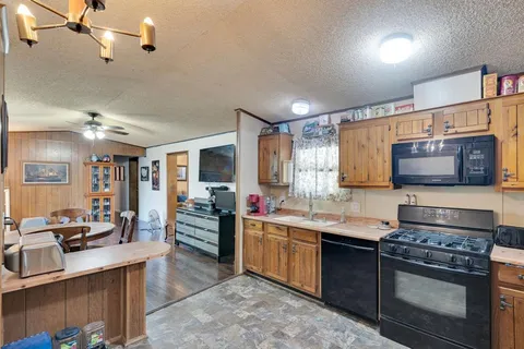 a kitchen with lots of counter top space and stainless steel appliances