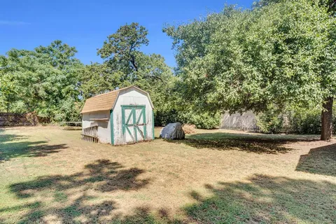 a view of swimming pool with a yard