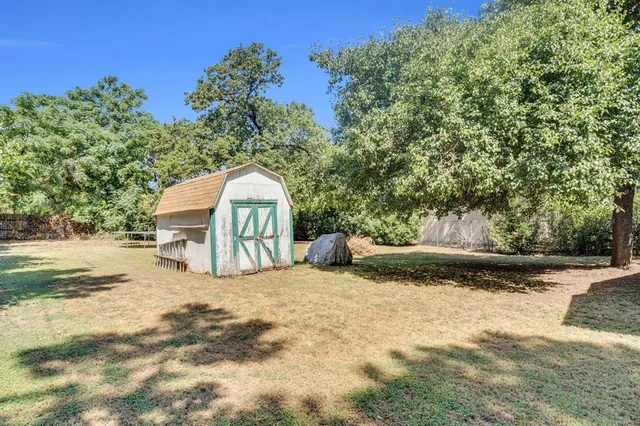 a view of swimming pool with a yard