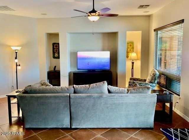 a living room with a couch and a flat screen tv