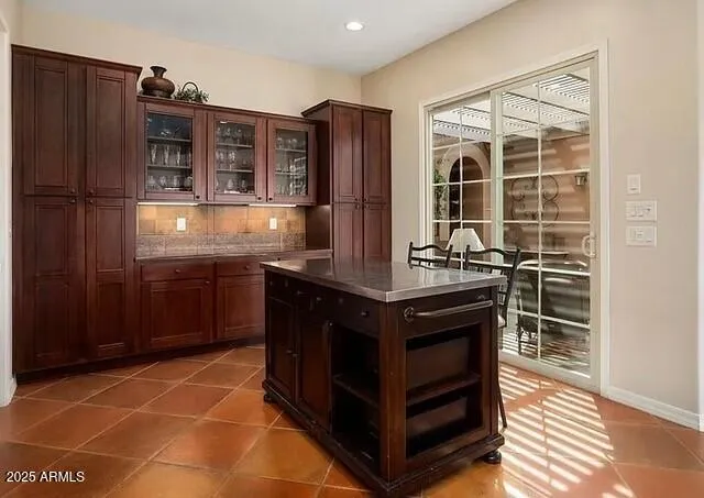a kitchen with stainless steel appliances a sink and a refrigerator
