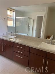 14412 Killion Street Sherman Oaks, CA 91401 - Photo 15 of 21 a bathroom with a granite countertop sink and a mirror