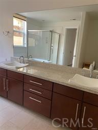 14412 Killion Street Sherman Oaks, CA 91401 - Photo 16 of 21 a bathroom with a granite countertop sink and a mirror