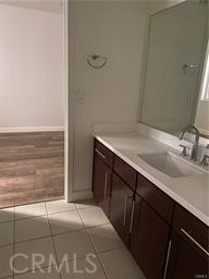 14412 Killion Street Sherman Oaks, CA 91401 - Photo 17 of 21 a bathroom with a sink and a mirror