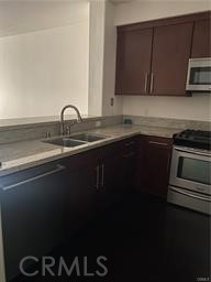14412 Killion Street Sherman Oaks, CA 91401 - Photo 5 of 21 a kitchen with a sink and cabinets