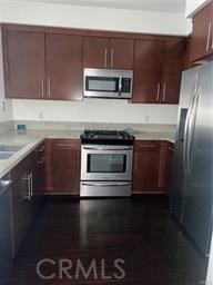 14412 Killion Street Sherman Oaks, CA 91401 - Photo 7 of 21 a kitchen with a sink and stainless steel appliances