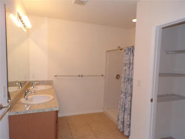 a bathroom with a sink and shower
