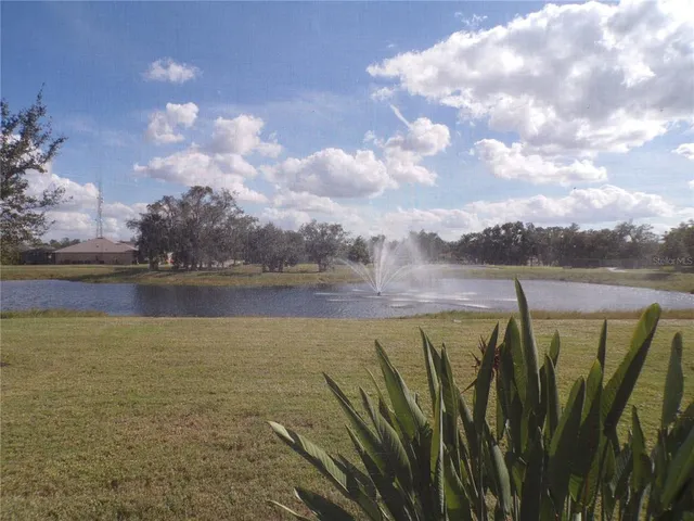 a view of a lake with a big yard