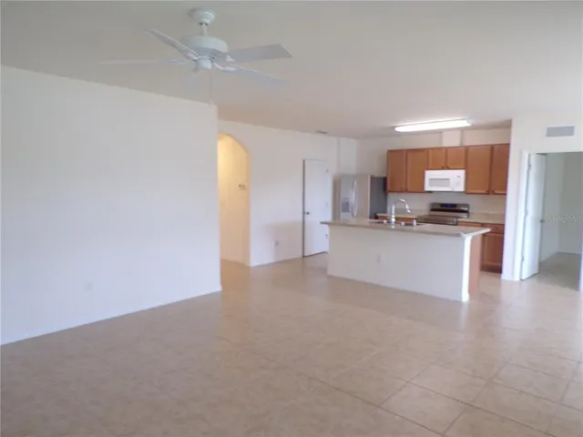 a view of a kitchen with a sink cabinets and a window
