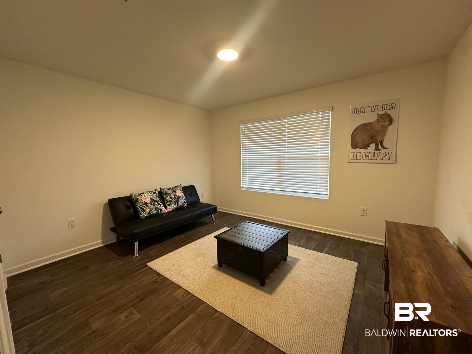 23792 Unbridled Loop Daphne, AL 36526 - Photo 22 of 36 Living area with dark wood finished floors