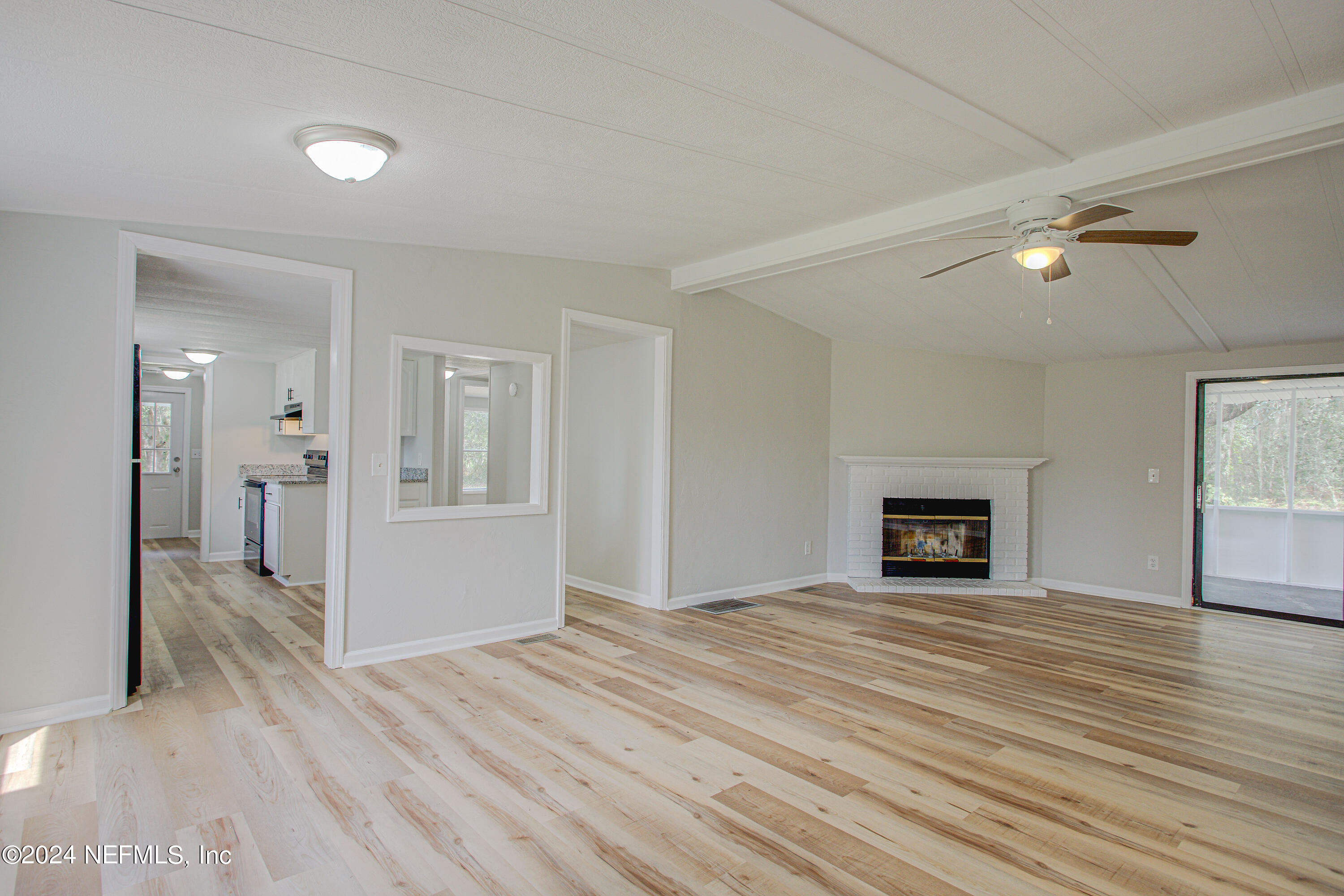 7677 Oak Forest Road Keystone Heights, FL 32656 - Photo 15 of 54 a view of a livingroom with wooden floor