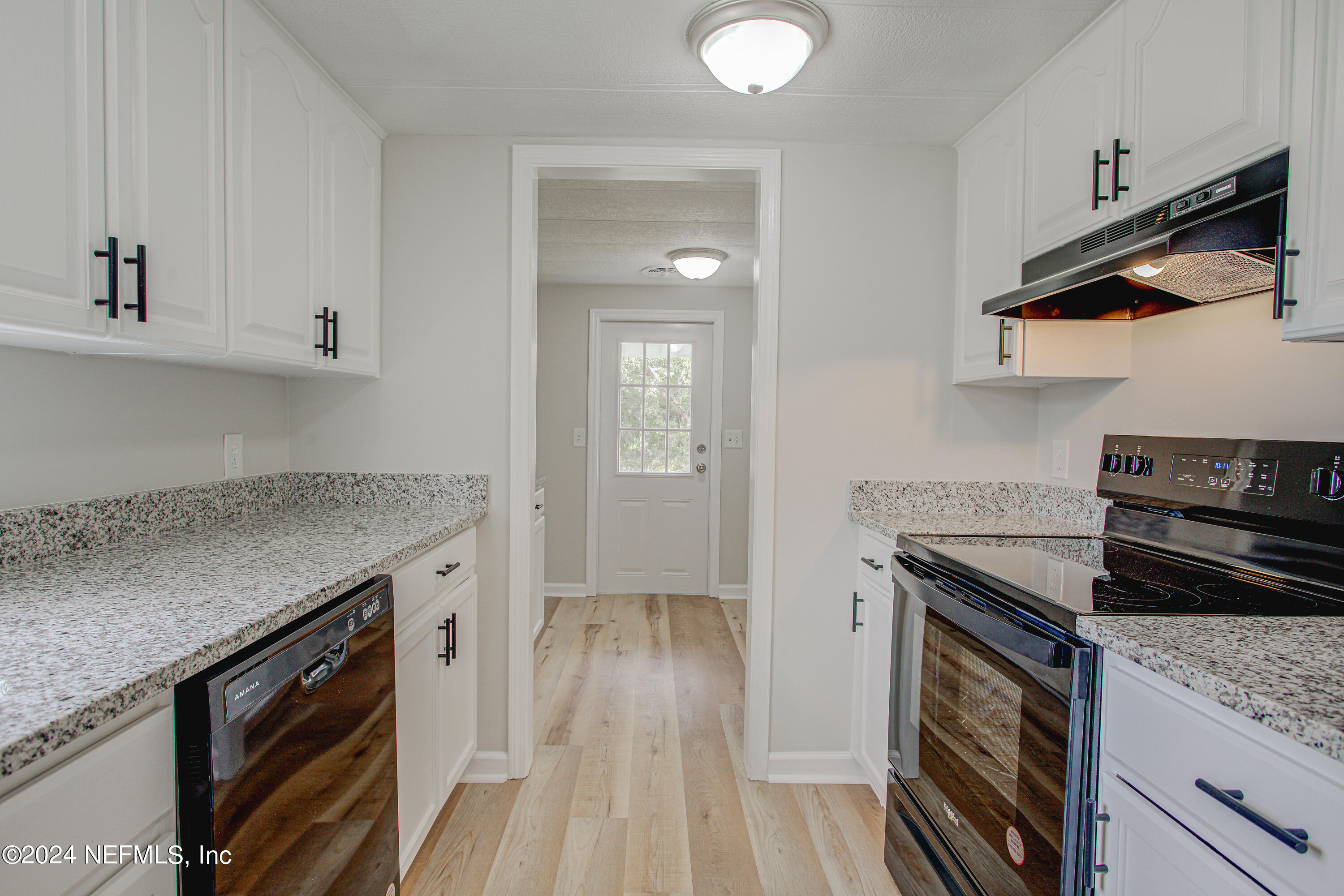 7677 Oak Forest Road Keystone Heights, FL 32656 - Photo 17 of 54 a kitchen with a stove and a sink
