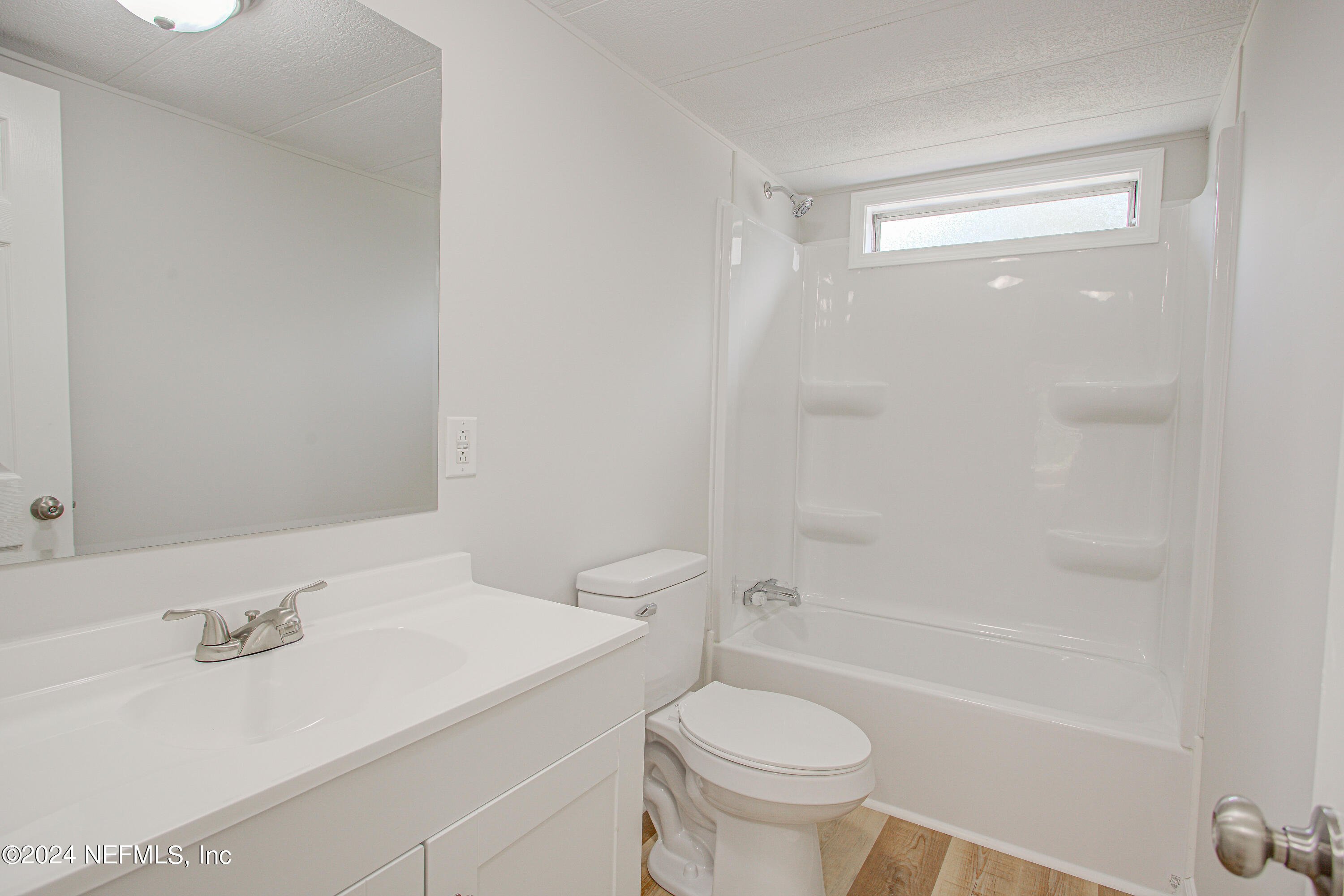 7677 Oak Forest Road Keystone Heights, FL 32656 - Photo 25 of 54 a bathroom with a sink a toilet and shower