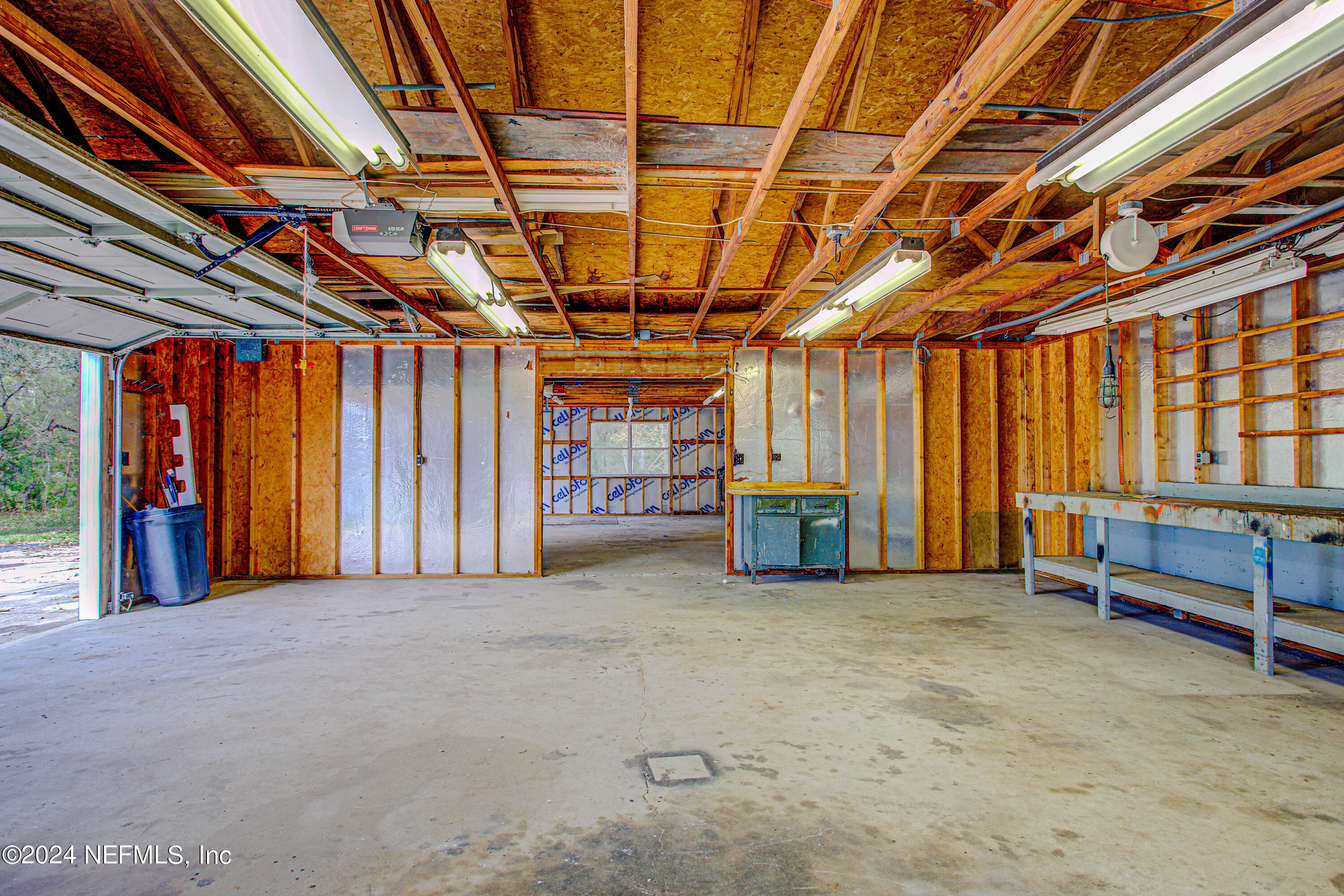 7677 Oak Forest Road Keystone Heights, FL 32656 - Photo 40 of 54 a view of a room with wooden walls and furniture