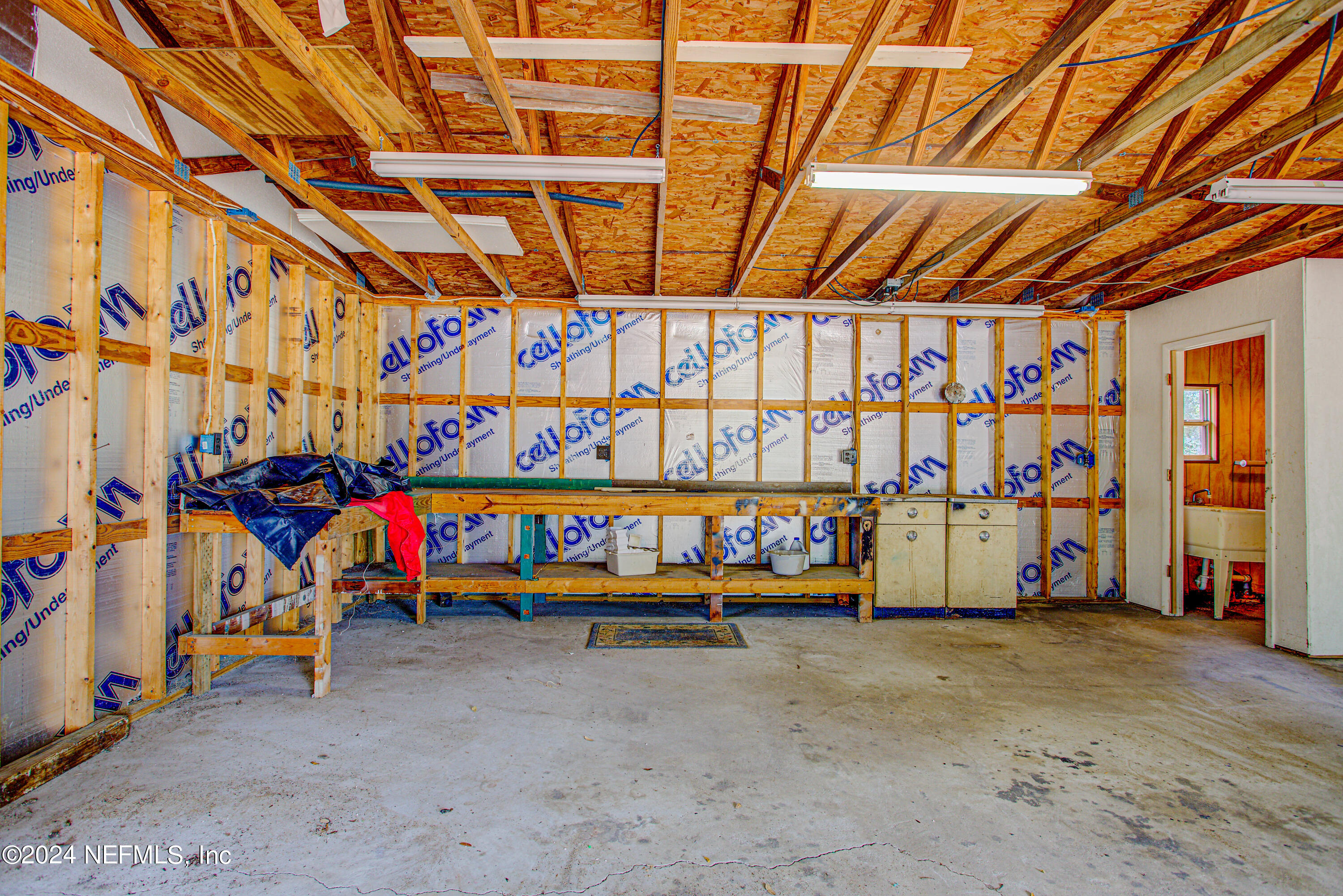 7677 Oak Forest Road Keystone Heights, FL 32656 - Photo 44 of 54 a view of an empty room with wooden walls