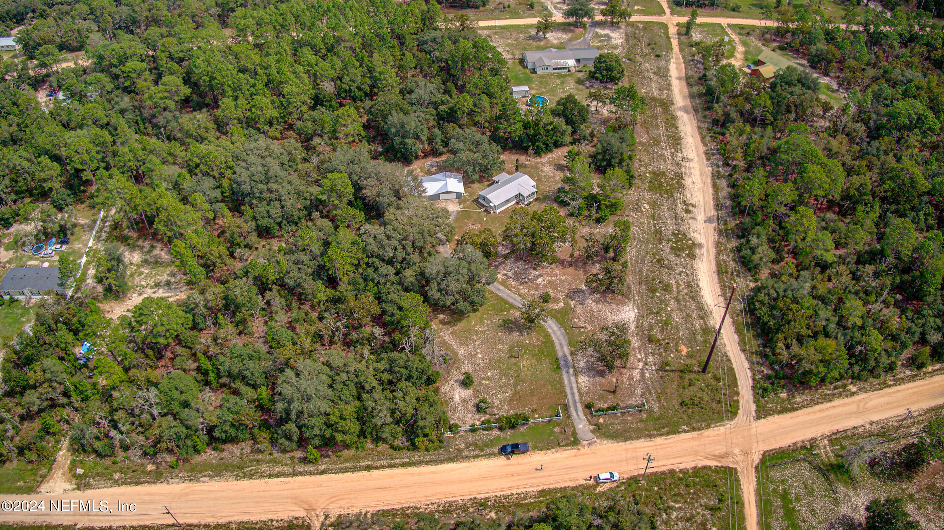 7677 Oak Forest Road Keystone Heights, FL 32656 - Photo 47 of 54 a view of a yard with wooden wall