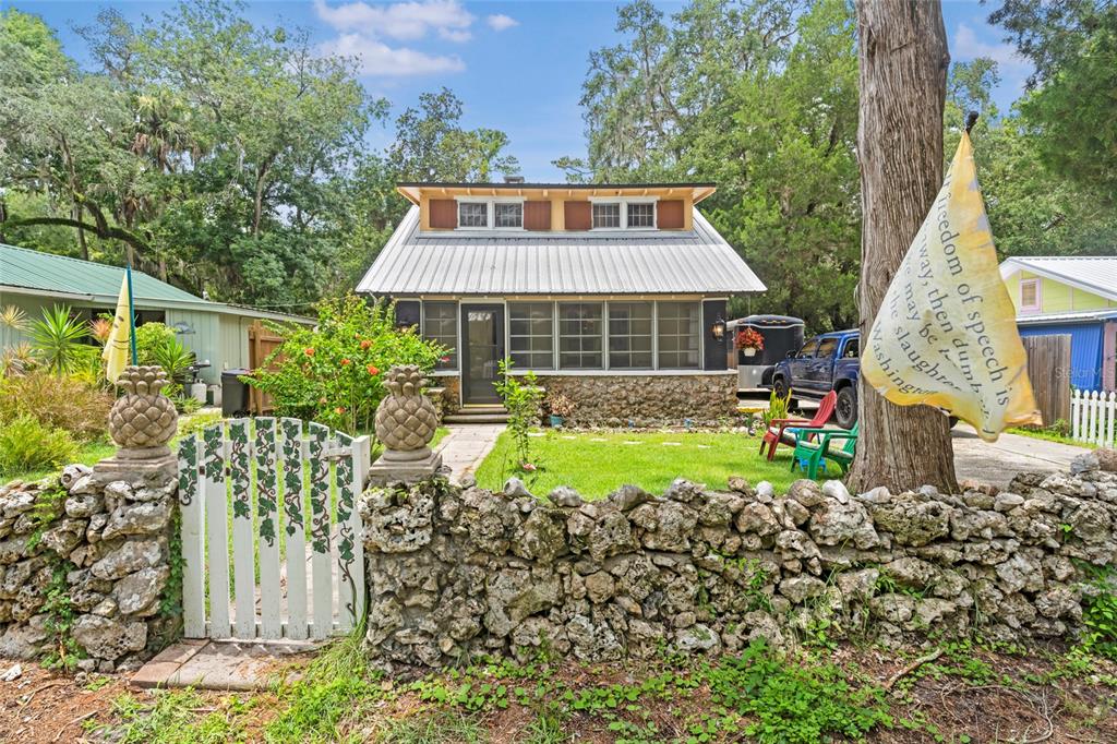 11 62nd Street Yankeetown, FL 34498 - Photo 1 of 33 a front view of a house with garden