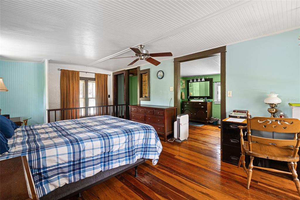 11 62nd Street Yankeetown, FL 34498 - Photo 18 of 33 a bedroom with a bed and wooden floor