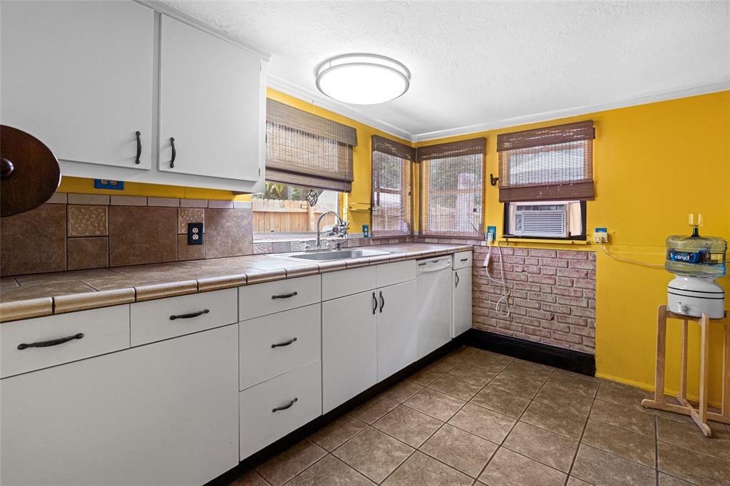 11 62nd Street Yankeetown, FL 34498 - Photo 23 of 33 a kitchen with cabinets and window