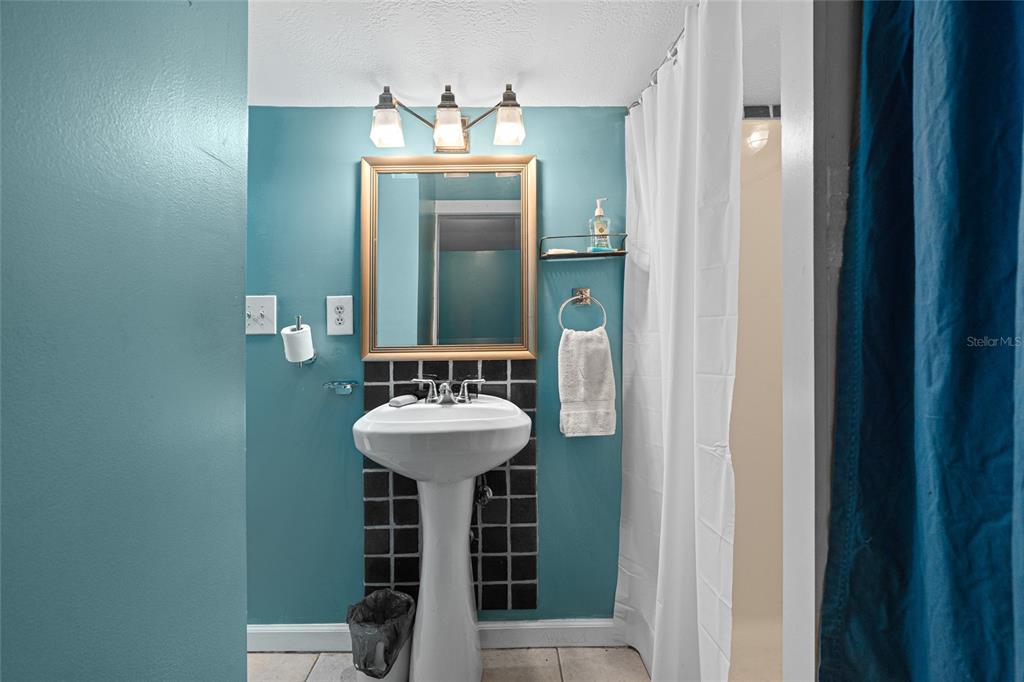 11 62nd Street Yankeetown, FL 34498 - Photo 29 of 33 a bathroom with a sink and a mirror