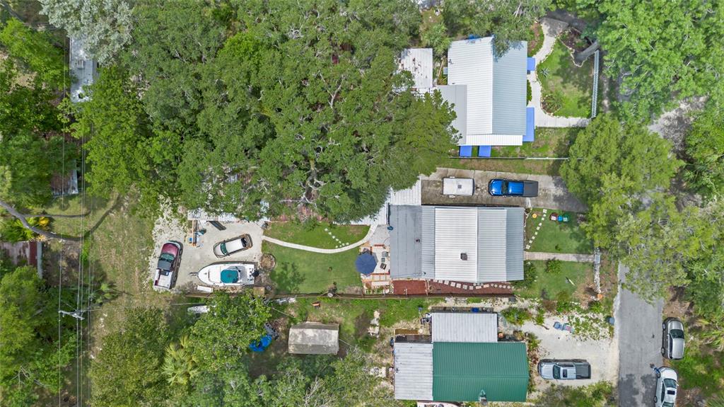 11 62nd Street Yankeetown, FL 34498 - Photo 3 of 33 an aerial view of a house with outdoor space and trees all around