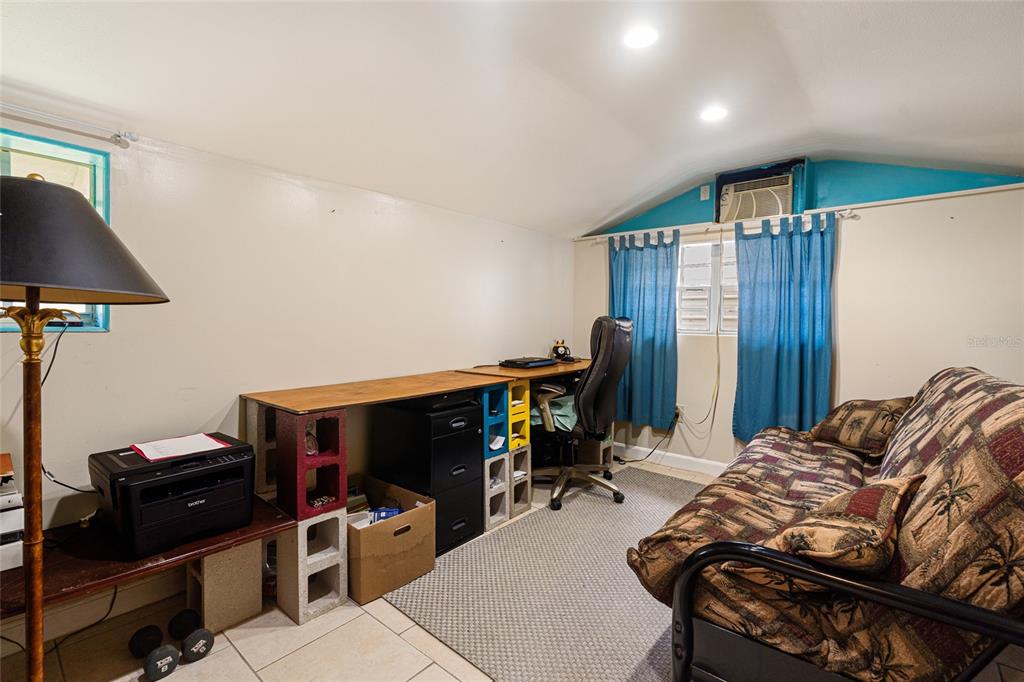 11 62nd Street Yankeetown, FL 34498 - Photo 31 of 33 a bedroom with bed and a workspace