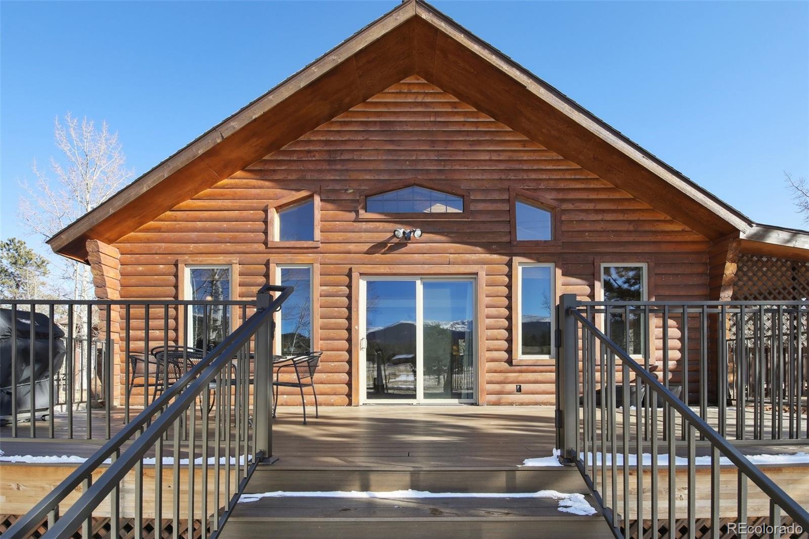 499 Clark Road Bailey, CO 80421 - Photo 2 of 27 a view of a house with wooden fence