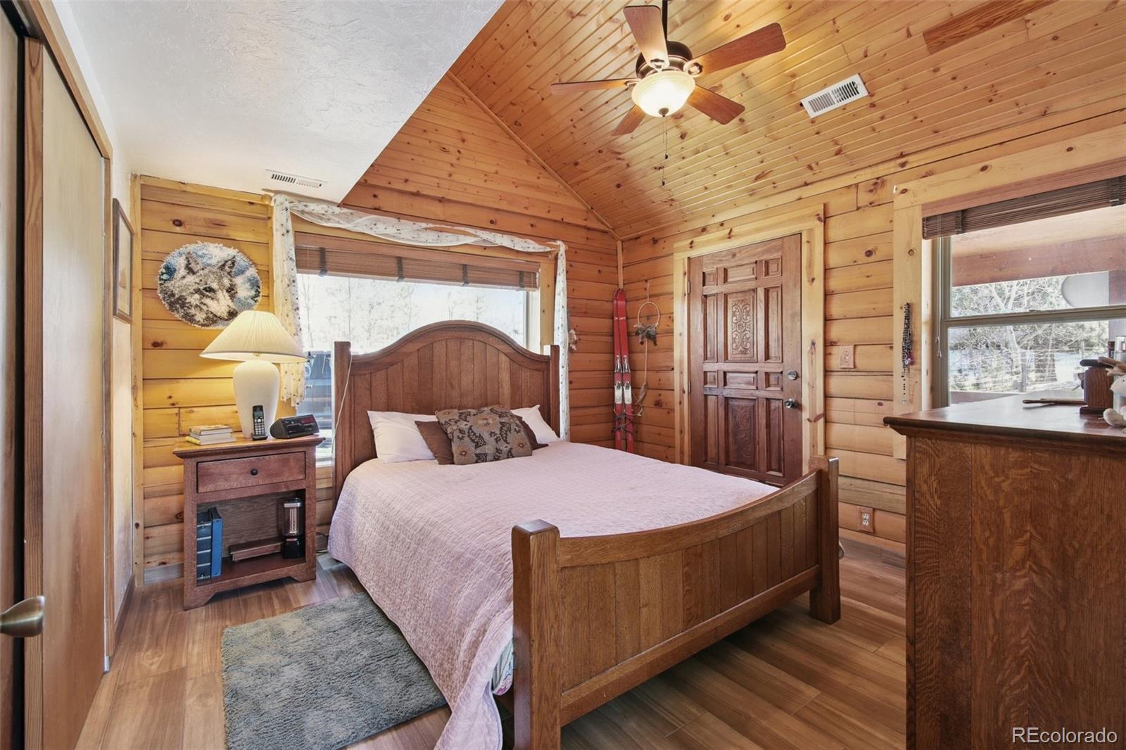 499 Clark Road Bailey, CO 80421 - Photo 10 of 27 a bedroom with a large bed and a window