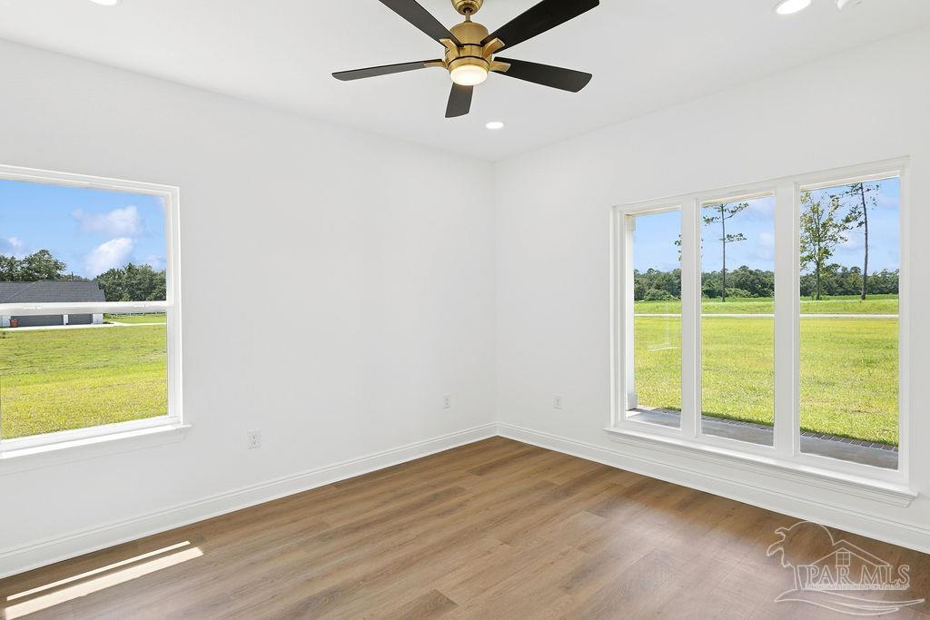 638 Ard Field Road Jay, FL 32565 - Photo 14 of 39 a view of an empty room with a window and kitchen view