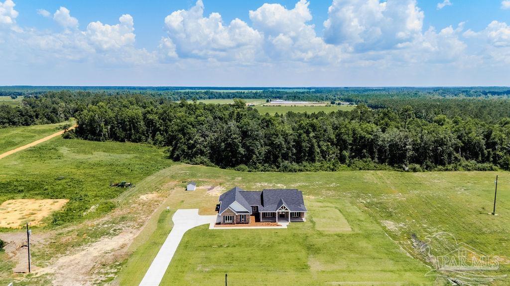 638 Ard Field Road Jay, FL 32565 - Photo 34 of 39 a view of a big yard with table and chairs