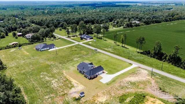 a view of a pool with a yard