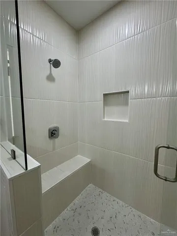 a bathroom with a bathtub and shower