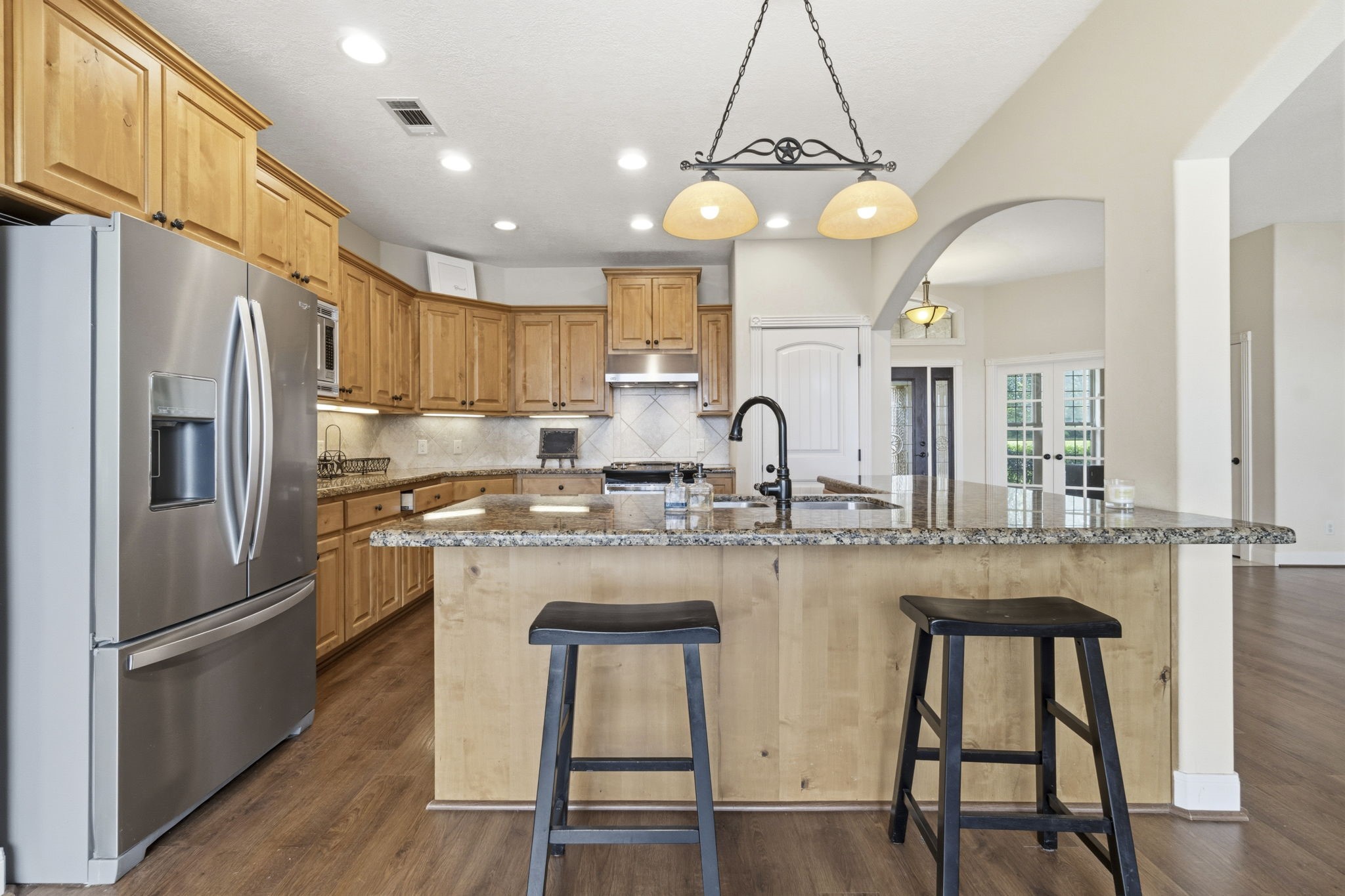 259 Memphis Bell Lane Trinity, TX 75862 - Photo 8 of 50 a kitchen with refrigerator a sink and chairs