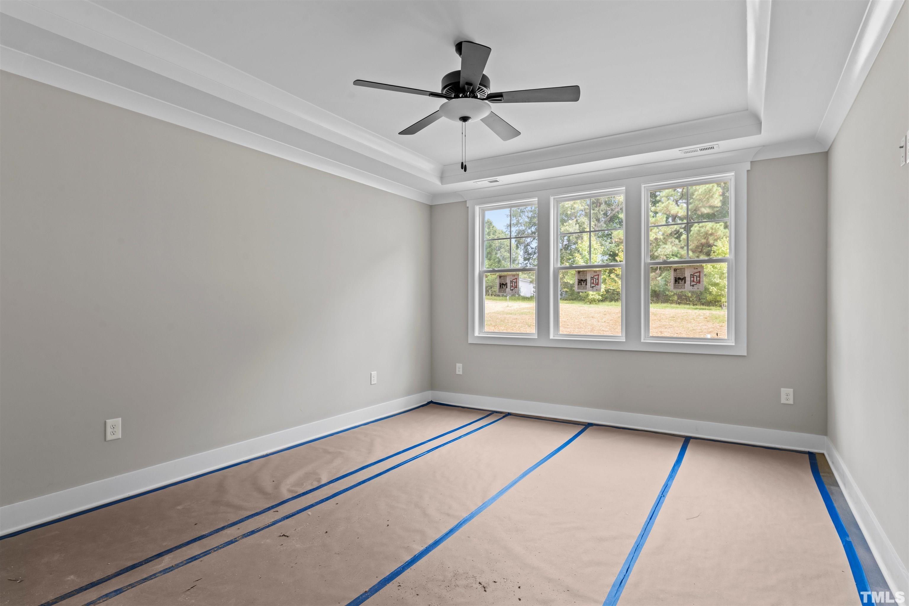 97 Buckstone Place Willow Spring, NC 27592 - Photo 17 of 21 a room with window and a ceiling fan