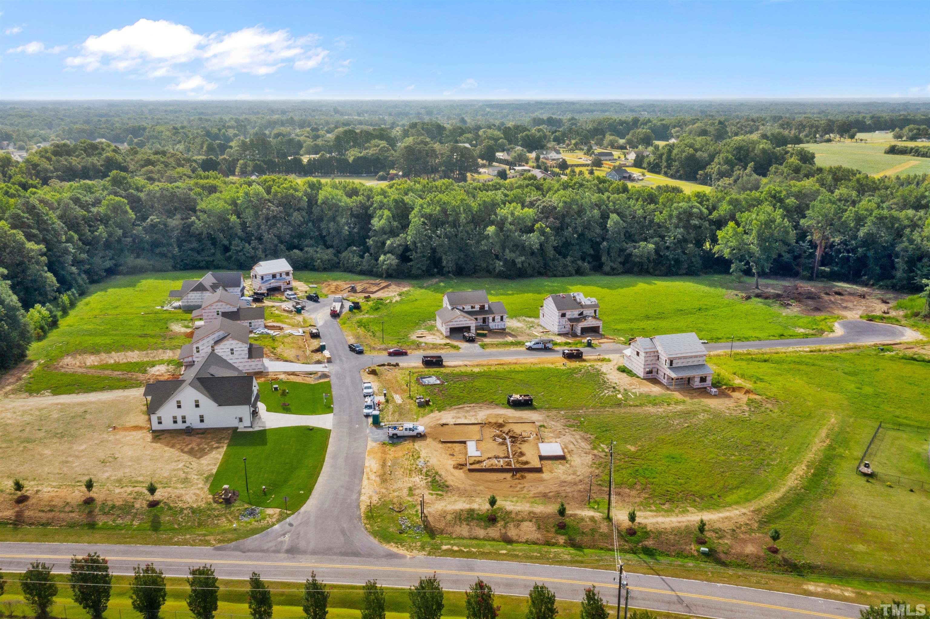 97 Buckstone Place Willow Spring, NC 27592 - Photo 3 of 21 an aerial view of a pool patio swimming pool and outdoor seating