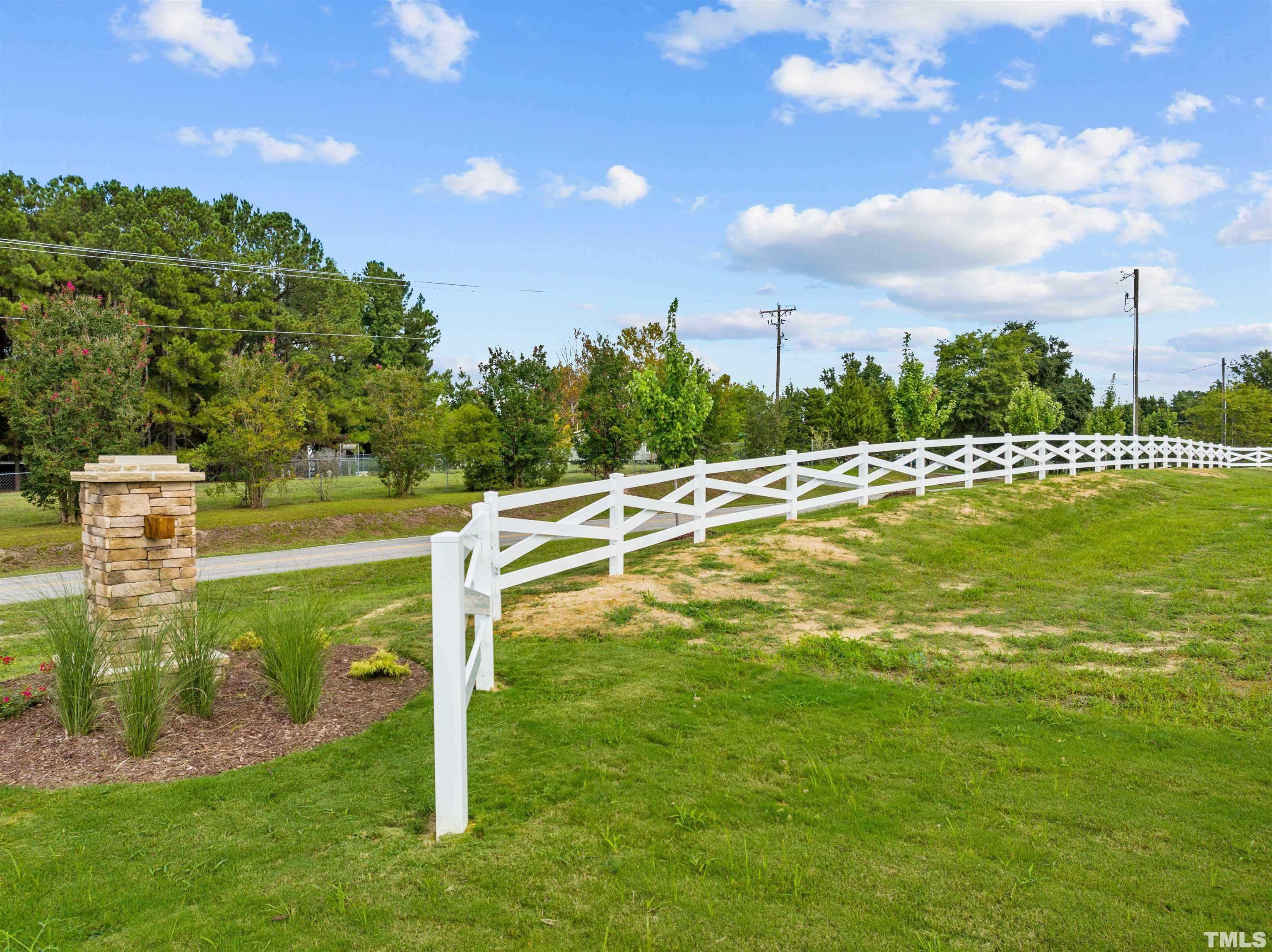 97 Buckstone Place Willow Spring, NC 27592 - Photo 9 of 21 a view of a swimming pool with a yard