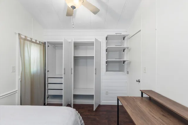 a room with closet and wooden floor