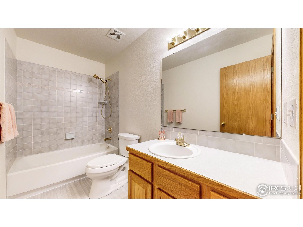711 Eagle Lane Estes Park, CO 80517 - Photo 11 of 20 a bathroom with a sink a toilet and shower
