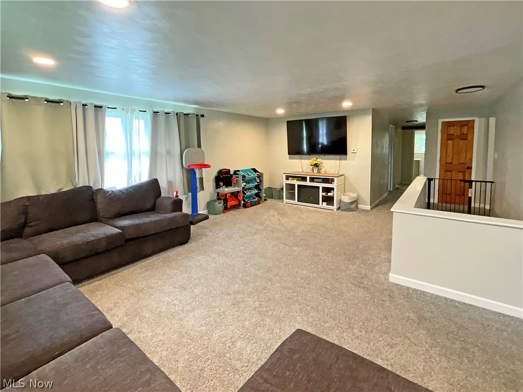 5637 Wylie Ridge Road New Cumberland, WV 26047 - Photo 3 of 21 Living room featuring light colored carpet
