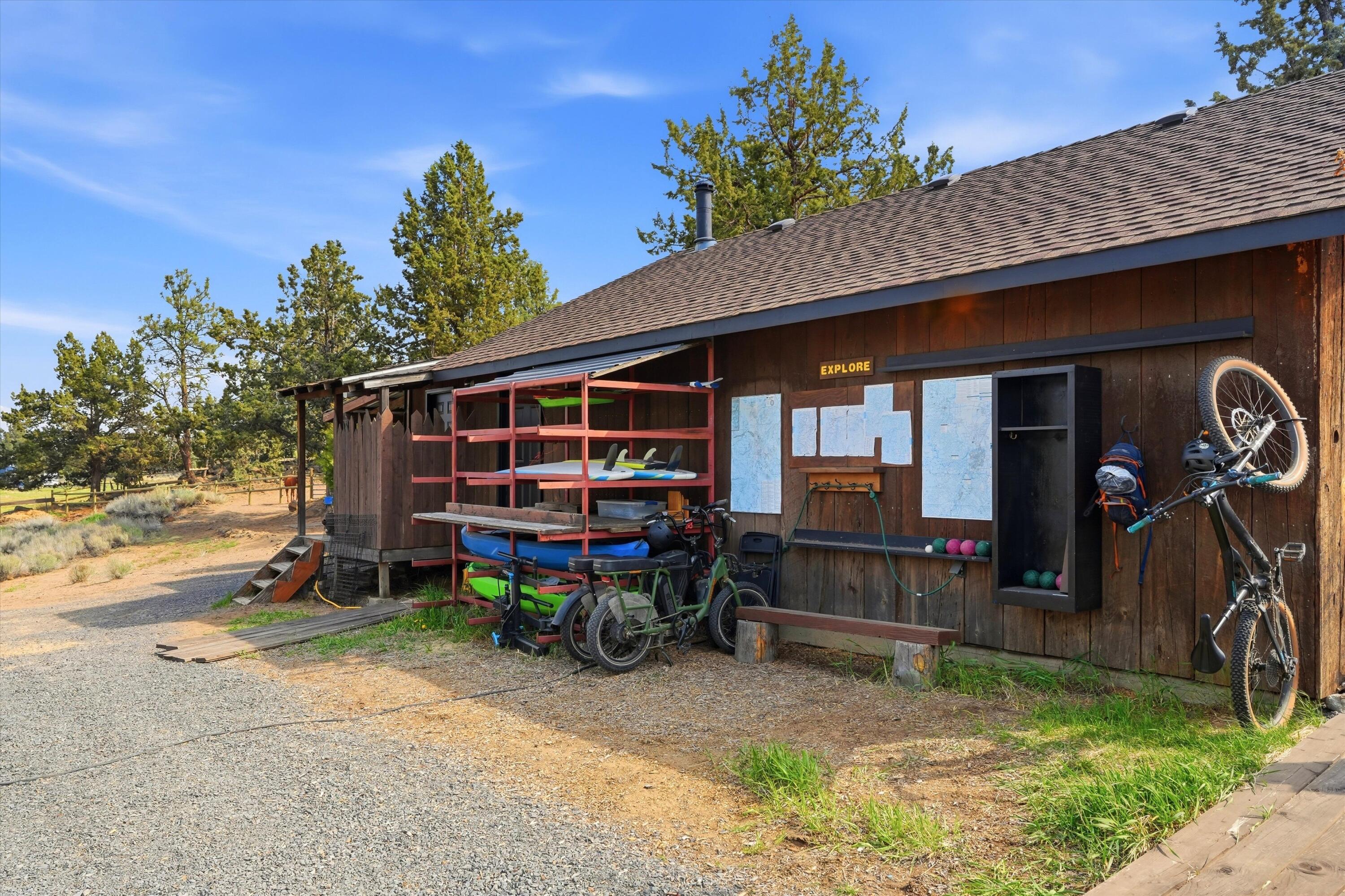 61280 Larsen Road Bend, OR 97702 - Photo 37 of 58 a view of a house with yard and sitting area