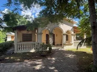 a view of a large house with a yard