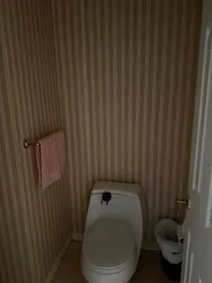 a bathroom with a toilet and a sink