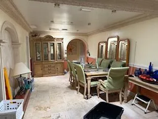 a view of a livingroom with furniture and mirror